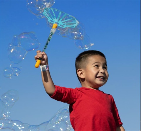 child-in-red-shirt-with-bubble-wand